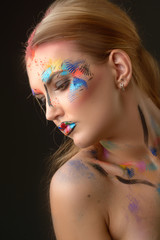 Naklejka premium Beautiful woman with art make-up 
