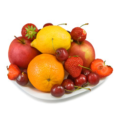  ripe strawberries, cherry, apple, orange and lemon on the plate