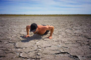 Man doing exercises on dry land