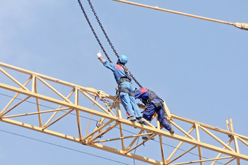 Men at work on the crane 