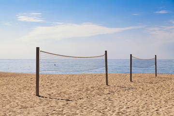 Two nets for beach voleyball with sea in the background