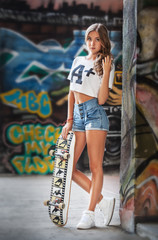 Portrait of young girl posing at city streets