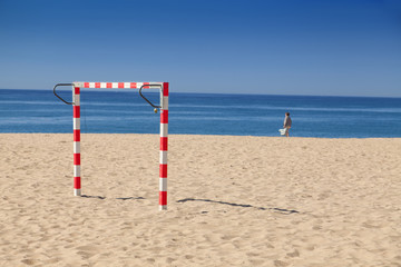Handball goal on a beach with ocean in the background