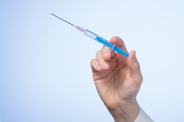 Doctor's hand with syringe