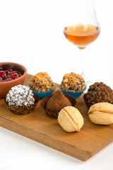 chocolate candies with glass of cognac