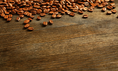 Coffee beans on wooden background
