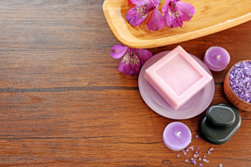 Beautiful composition of spa treatment on wooden table