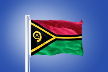 Flag of Vanuatu flying against a blue sky
