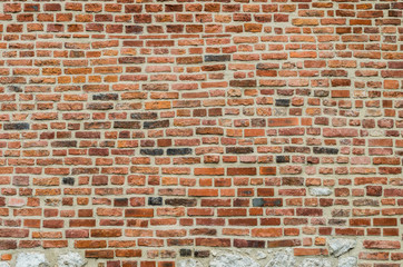 Medieval red brick wall
