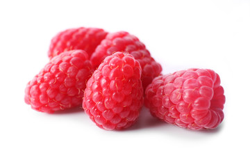 Red sweet raspberries isolated on white