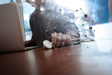 Medicine doctor hand working with modern computer and smart phon