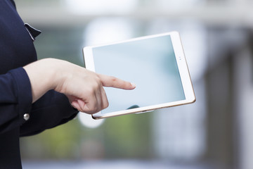 Closeup of a woman holding a digital tablet