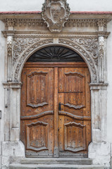 Fototapeta na wymiar Ancient renaissance gate with oak wood door