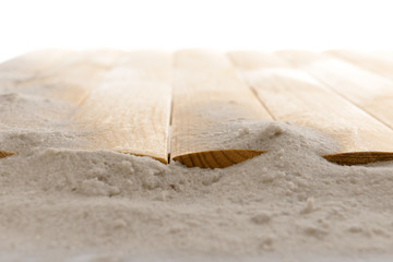 Sand with wooden planks, closeup