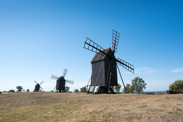Fototapeta premium Traditional windmills on the southern part of Swedish island Oland, a rural area which is a UNESCO world heritage site. 