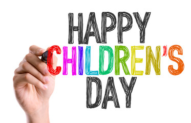 Hand with marker writing the word Happy Childrens Day