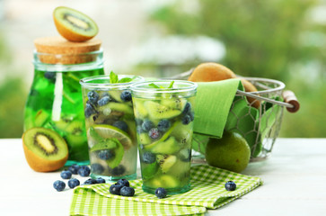 Kiwi and Blueberry cocktails on bright background