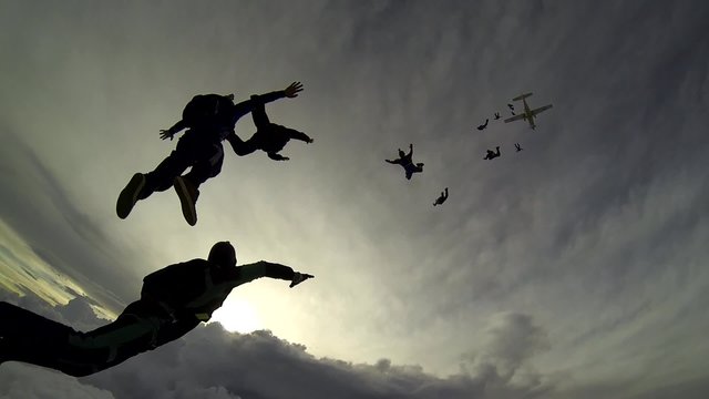 Skydiving group above the clouds