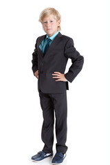 Young Caucasian boy a businessman full length in suit and tie, isolated on white background