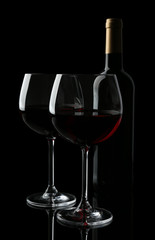 Wineglasses with red wine, isolated on black