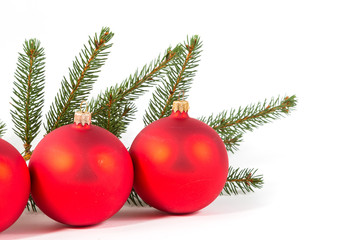 red Christmas balls and fir branch