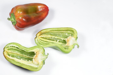 Red pepper and other one, green, cut in half