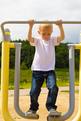 Fototapeta premium Child kid having fun in playground air walker.