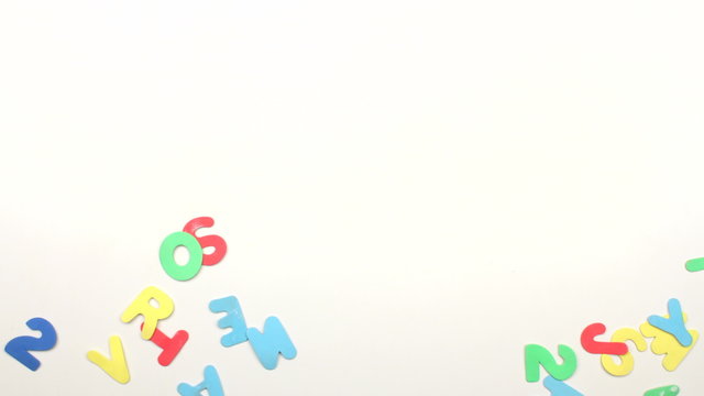 Colorful alphabet letters border on white background with space for text