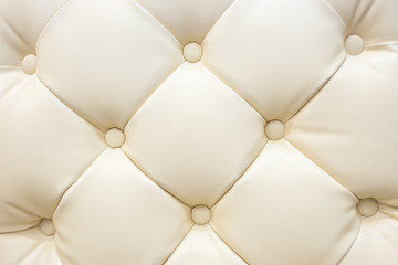 Genuine cream colour of leather upholstery background for a luxu