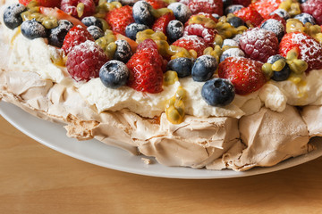 closeup of Pavlova dessert with fresh berries