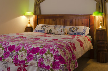 Bed with colorful floral pattern beadspread
