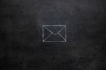 Email envelope chalk drawing on chalkboard
