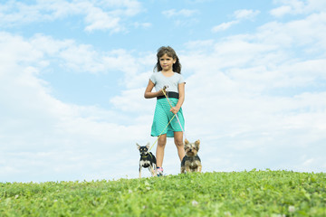 portrait of girl keeping pretty dog outdoor