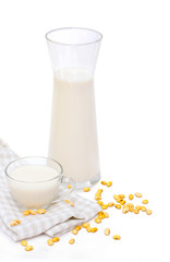 Soy milk with soy bean isolated on white background