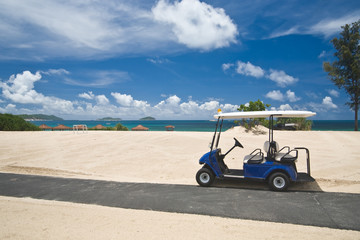 Golf cart on a beach © ymgerman