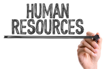 Hand with marker writing the word Human Resources