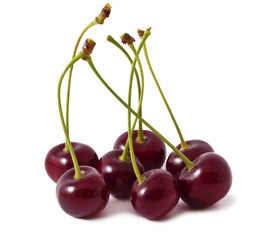 Handful of a red cherry on a white background