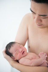 Asian chinese newborn baby and daddy in hospital