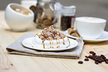 White meringues with brown chocolate stripes