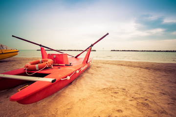 Typical red rescue boat in Italy, Romagna - obrazy, fototapety, plakaty