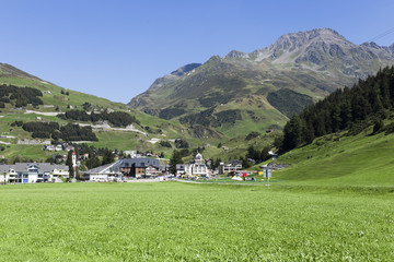 Fototapeta na wymiar beautiful switzerland background with grass and typical houses
