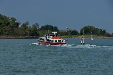 Obraz premium One boat in venetian lagoon, Italy