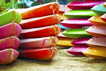 Stacking colorful canoes