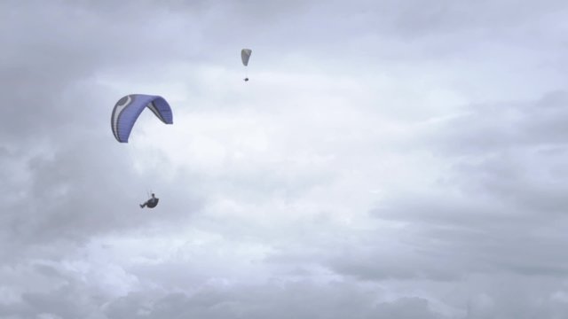 Open paragliding. Open a paragliding with cloudy sky background