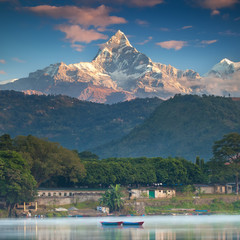 Never Ending Peace And Love. Two boats on a water and beautiful mountain peak on the background.  - 90521401