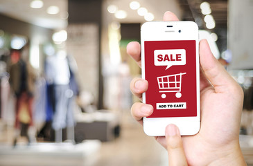 Sale and shopping on line concept on smart phone screen over blu