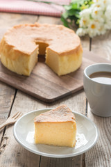 Chiffon cake on white dish with coffee.