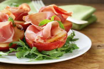 Italian appetizer grilled peaches with parma ham