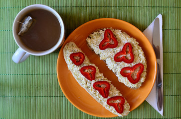 Light breakfast with butter, pepper and cup of tea.