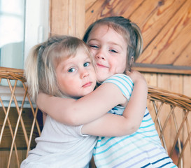  little sisters hugging